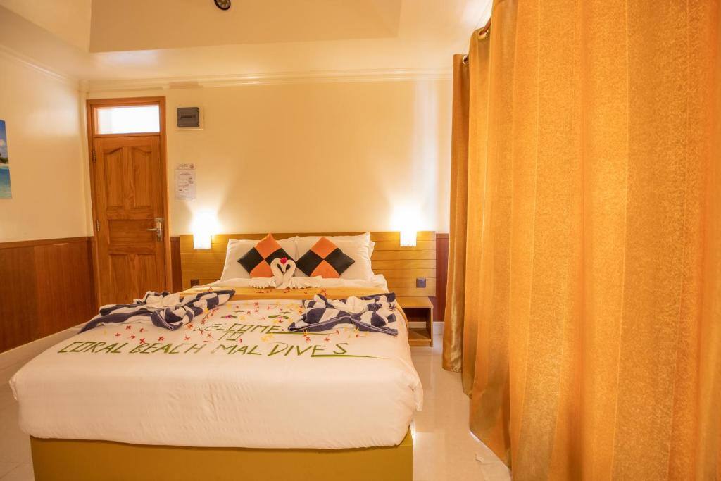 Deluxe Double Room (1 adult + 1 child) - Coral Beach Maldives
